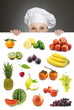 Female chef looking over fruit billboard