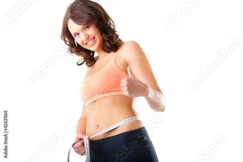 Foto: Diät - junge Frau misst Taille zum Abnehmen Diät - junge Frau misst Taille zum Abnehmen