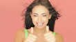 Beautiful brunette giving a thumbs up