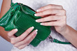 Female hands with manicure with handbag