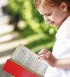 Photo: Beautiful little girl on read book Beautiful little girl on read book