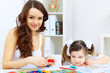 Photo: Mother and daughter studying Mother and daughter studying