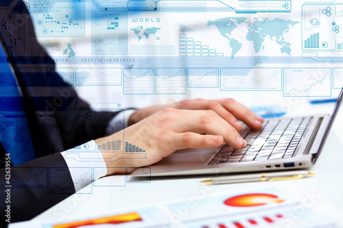 Photo: Business person working on computer Business person working on computer