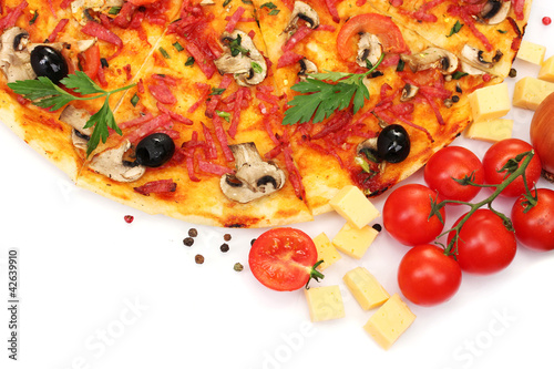 Photo: delicious pizza and vegetables isolated on white. delicious pizza and vegetables isolated on white.