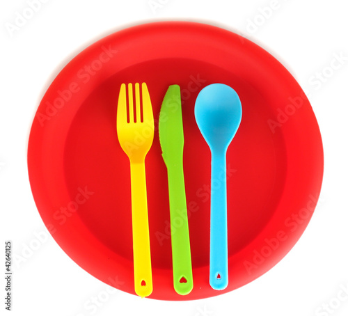 Photo: bright plastic disposable tableware isolated on white bright plastic disposable tableware isolated on white