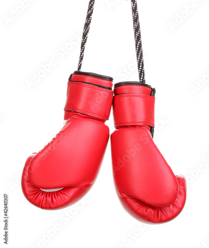 Photo: Red boxing gloves hanging isolated on white Red boxing gloves hanging isolated on white