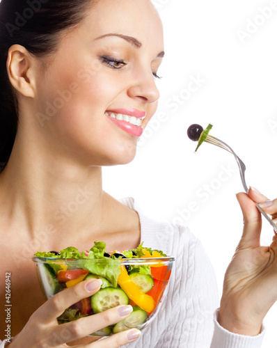 Foto: Smiling woman with salad, on white Smiling woman with salad, on white