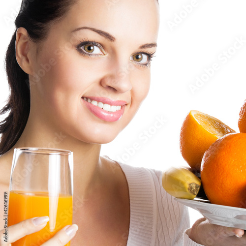 Foto: Girl with fruits and glass of orange juice, on white Girl with fruits and glass of orange juice, on white