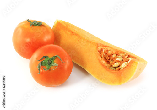 Photo: pumpkin and tomatoes on a white background pumpkin and tomatoes on a white background