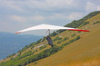 Hang glider pilot in Italian mountains
