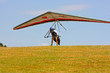 Hang glider pilot in Italian mountains