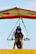 Hang glider pilot in Italian mountains
