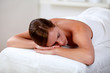 Foto: Young woman lying on a stretcher Young woman lying on a stretcher