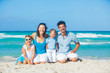 Family having fun on tropical beach