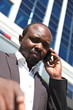 Young african businessman, talking mobile phone