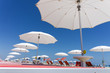 white beach umbrellas on Rimini beach, Italy