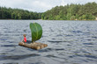 Phantasie - Junger Angler auf Floß