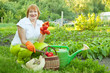 Happy mature woman with vegetables
