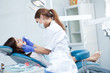 Foto: woman dentist working woman dentist working