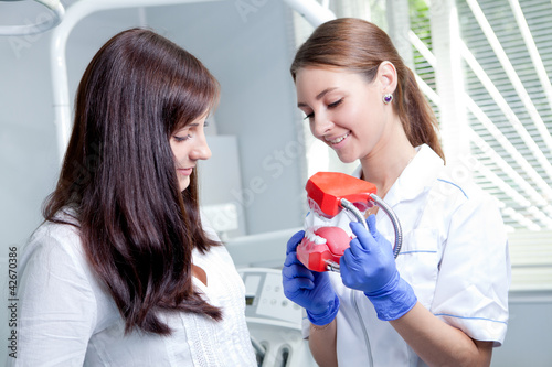 Photo: female doctor with jaws female doctor with jaws