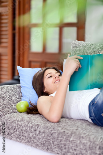 Photo: Teen girl reading book Teen girl reading book