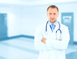 Foto: Frontal portrait of doctor in white coat and stethoscope Frontal portrait of doctor in white coat and stethoscope