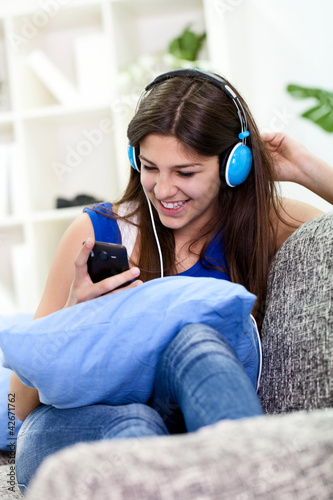 Photo: pretty happy girl listening to music pretty happy girl listening to music
