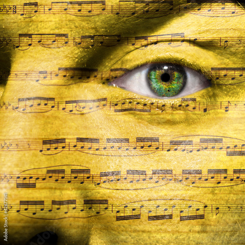 Photo: Face with eye showing sheet music Face with eye showing sheet music
