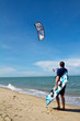 kitesurfer and his kite at sky background