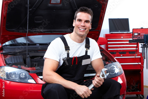 Photo: Auto mechanic with a wrench. Auto mechanic with a wrench.