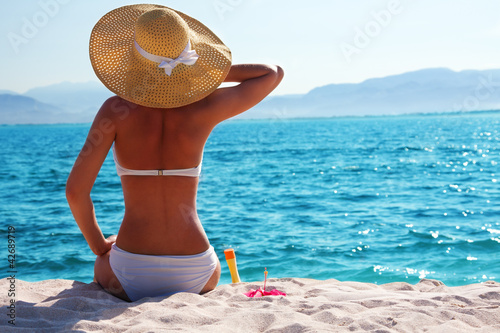 Photo: woman resting on the beach woman resting on the beach