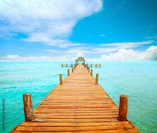 Photo: Vacations And Tourism Concept. Jetty on Isla Mujeres, Mexico Vacations And Tourism Concept. Jetty on Isla Mujeres, Mexico