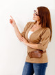 Casual woman pointing