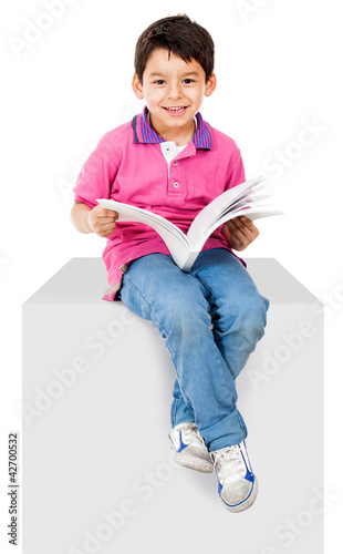 Photo: Kid reading a book Kid reading a book