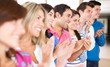 Group of people applauding