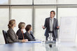 Photo: Businessman leading meeting in conference room Businessman leading meeting in conference room