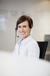 Portrait of smiling businesswoman wearing headset