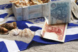 Drachmen auf griechischer Flagge
