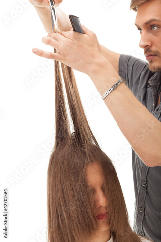 Foto: Professional hairdresser with long hair model, isolated on white Professional hairdresser with long hair model, isolated on white