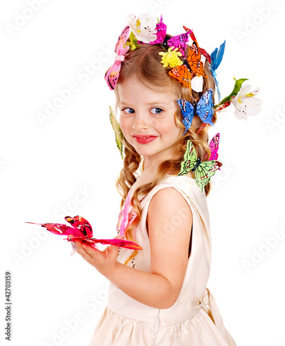 Photo: Little girl in spring hairstyle and butterfly. Isolated. Little girl in spring hairstyle and butterfly. Isolated.