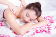 woman smile getting spa treatment with rose
