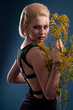 Photo: blonde woman with a branch blonde woman with a branch