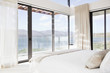 Modern bedroom with view of lake