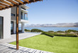 View of lake from patio of modern house
