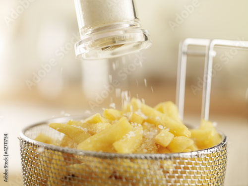 Photo: French fries sprinkled with salt French fries sprinkled with salt