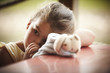 Close up of girl with stuffed animal sucking thumb