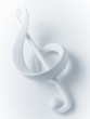 Close up of treble clef musical note on white background