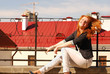 The beautiful red girl on a roof