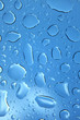 Photo: water drops on glass against blue sky water drops on glass against blue sky