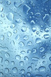 Photo: water drops on glass against blue sky water drops on glass against blue sky